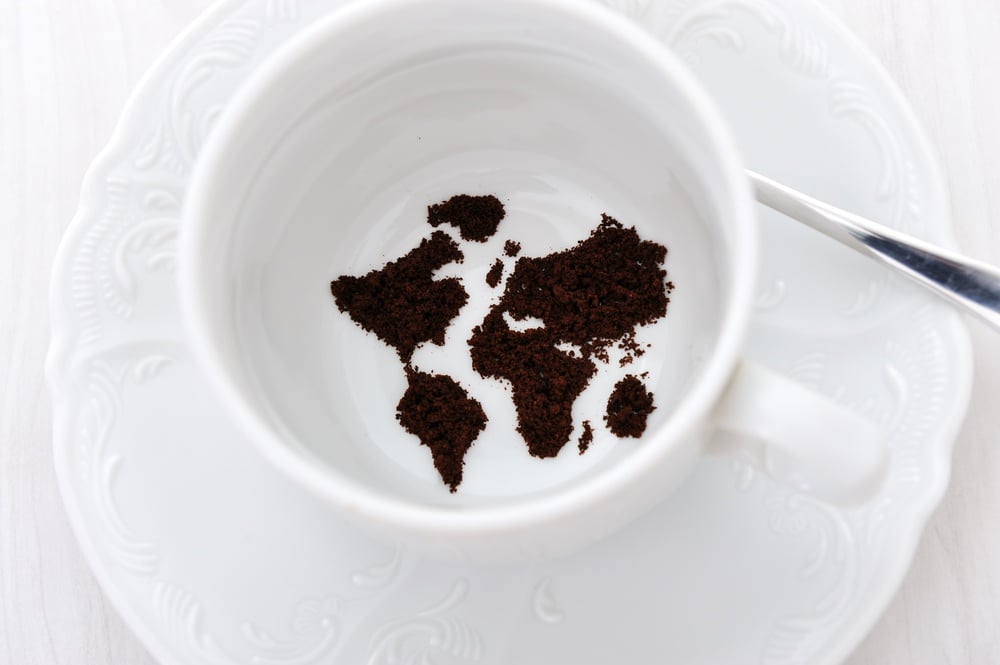 World map in coffee cup